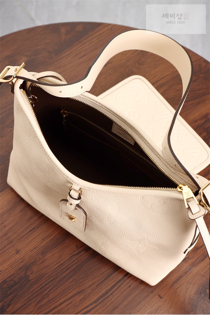 Louis Vuitton 루이비통 캐리올 PM 앙프렝트 모노그램 M46293 크림 Bag 11번 이미지