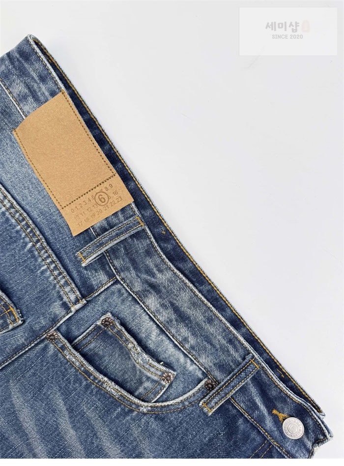 Maison Margiela 메종 마르지엘라 트위스트 와이드 레그 진 의류 4번 이미지